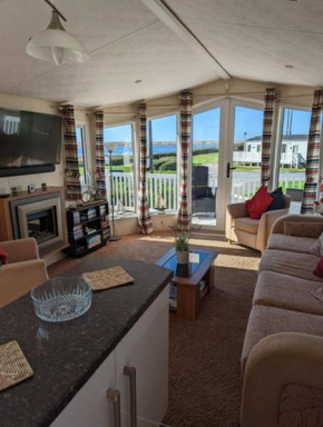 Lovely and Bright Caravan Haven Littlesea with views across the Fleet Lagoon